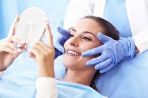 woman smiling at the dentist
