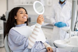 woman smiling at the dentist