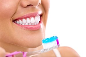 woman brushing her teeth